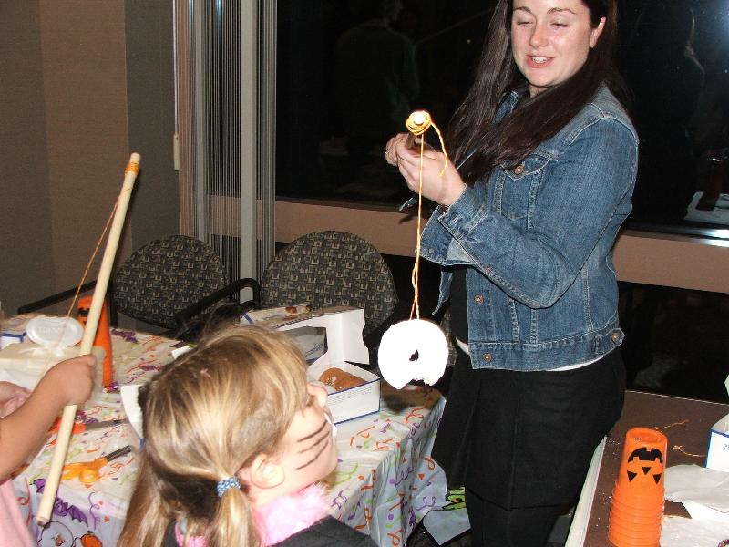 abbott 2006 kid halloween party - klea eating donut on string 